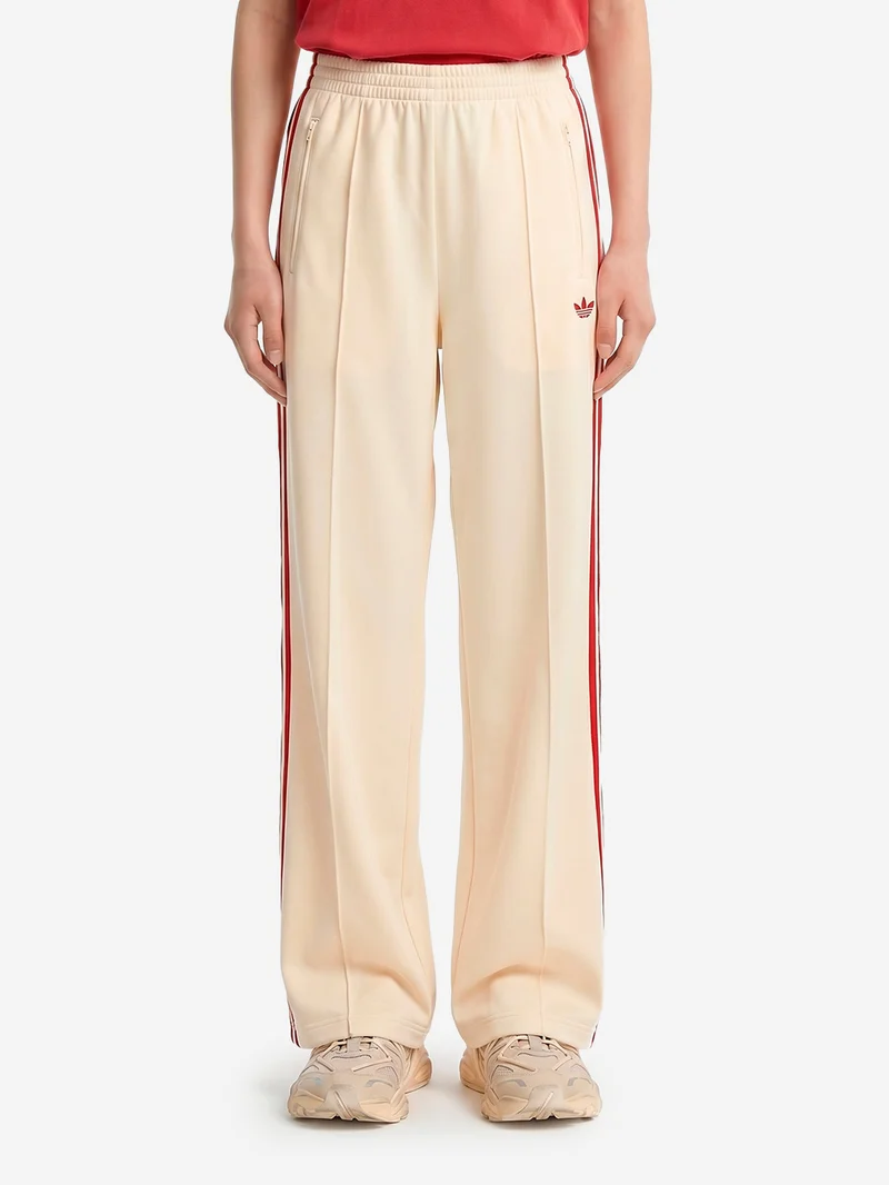 Pantaloni loose Firebird vaniglia con stripes rosse