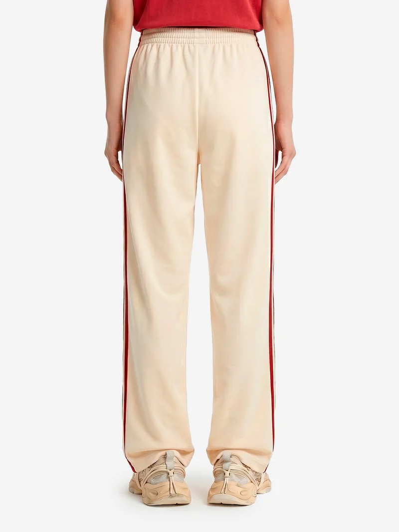 Pantaloni loose Firebird vaniglia con stripes rosse
