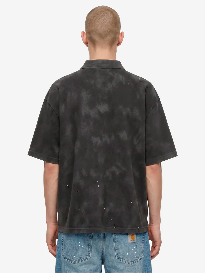 Polo Painter nera con trattamento distressed e vernice