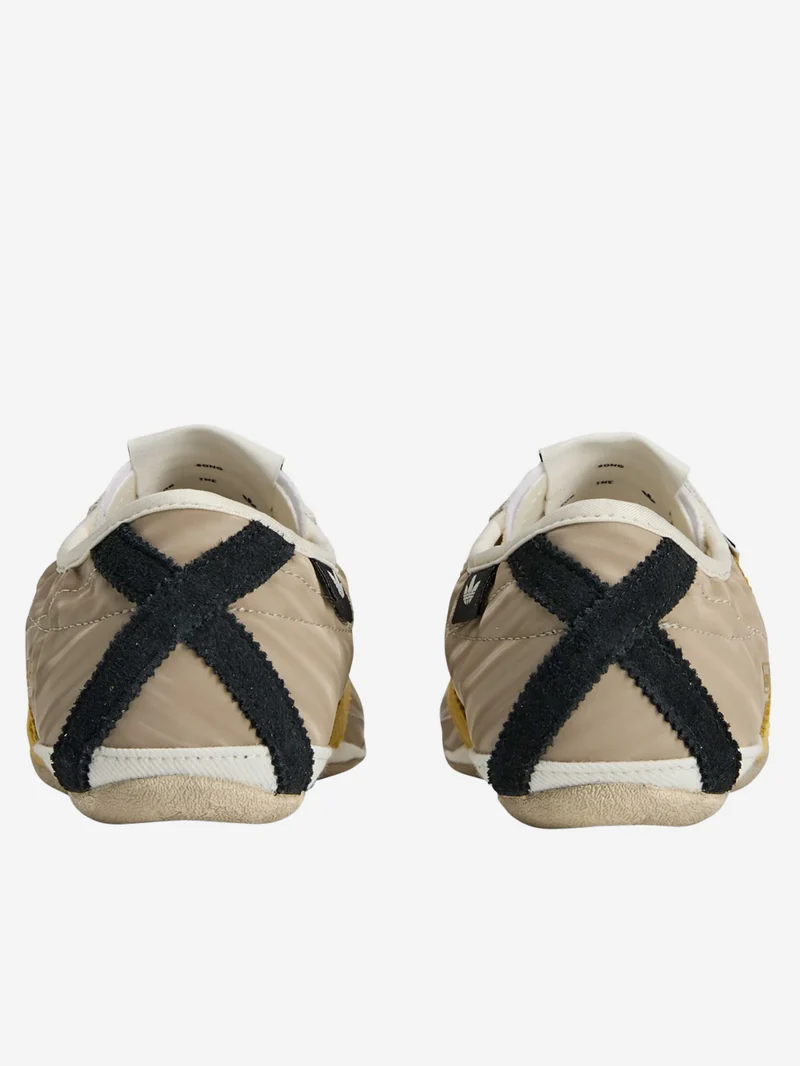 W Tokyo x Song For The Mute off white con giallo