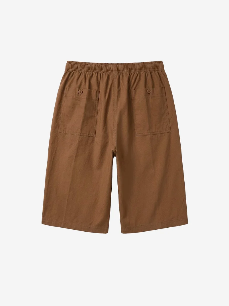 Shorts oversize marroni pleated con Swoosh