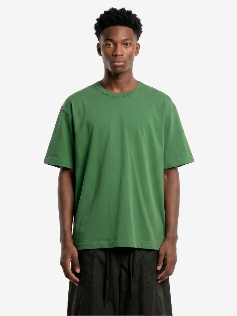 T-shirt in jersey di cotone verde con logo CDG sul retro