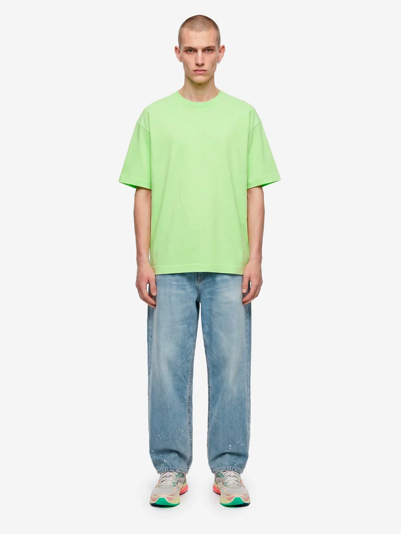 T-shirt in jersey di cotone verde con logo CDG sul retro
