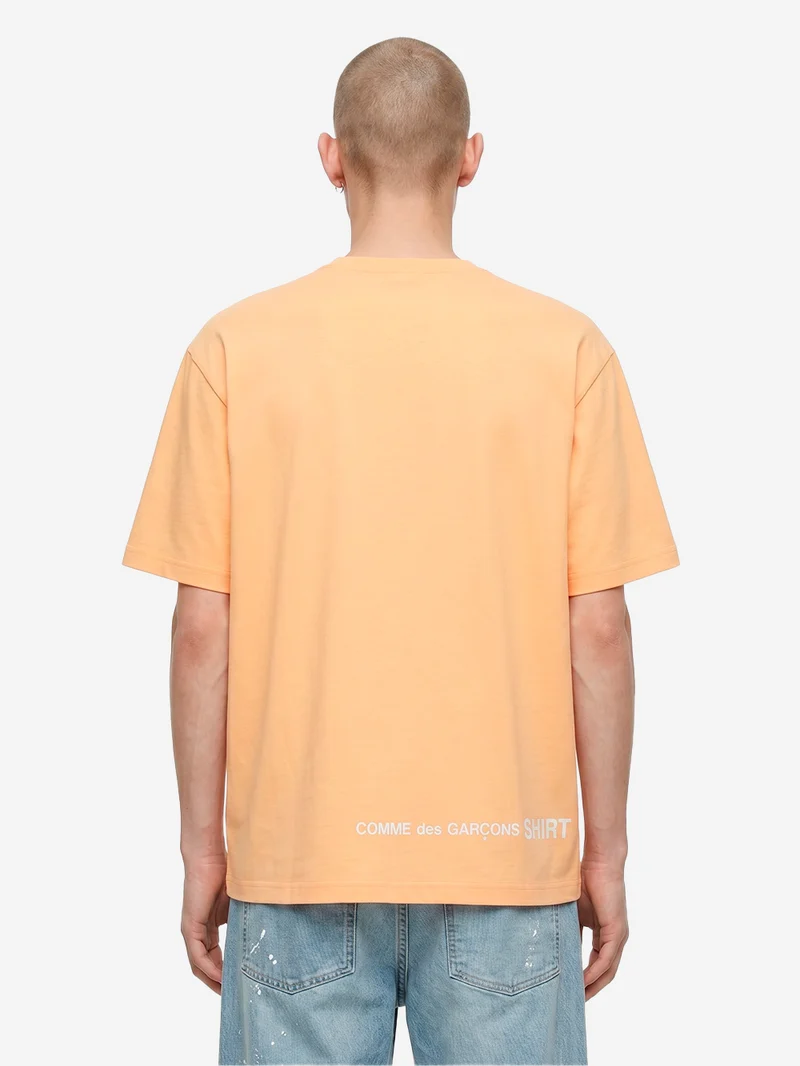 T-shirt in jersey di cotone arancione con logo CDG sul retro
