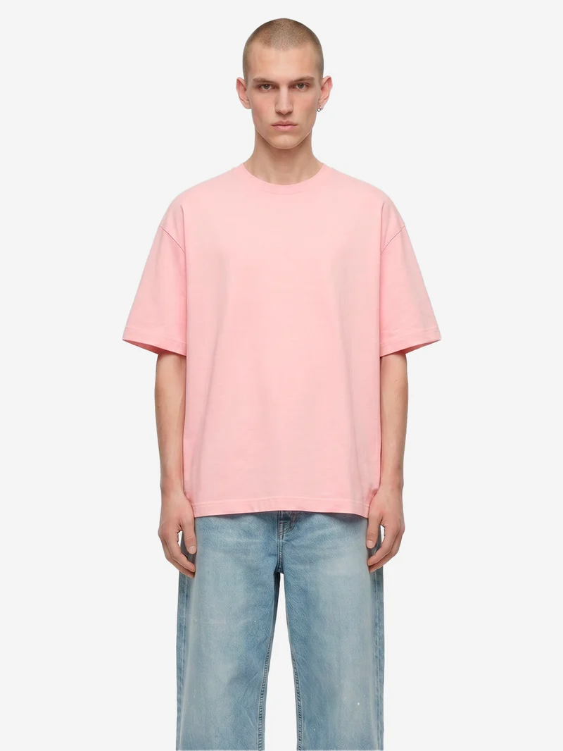 T-shirt in jersey di cotone rosa con logo CDG sul retro