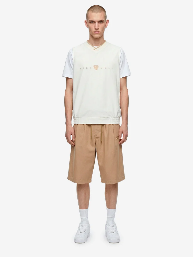 Shorts oversize beige pleated con Swoosh