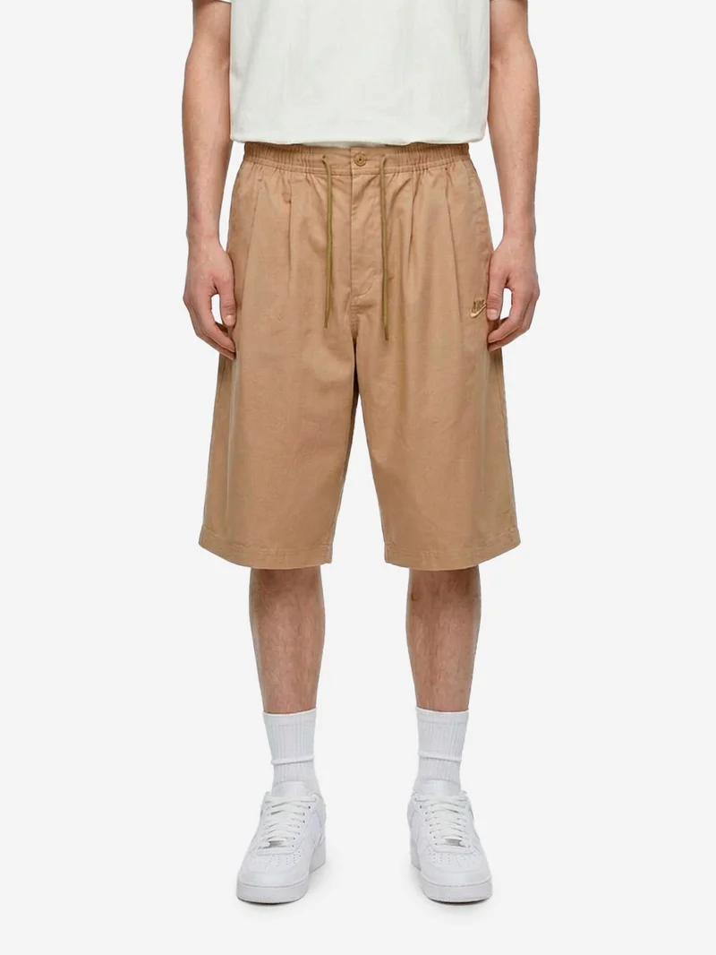 Shorts oversize beige pleated con Swoosh