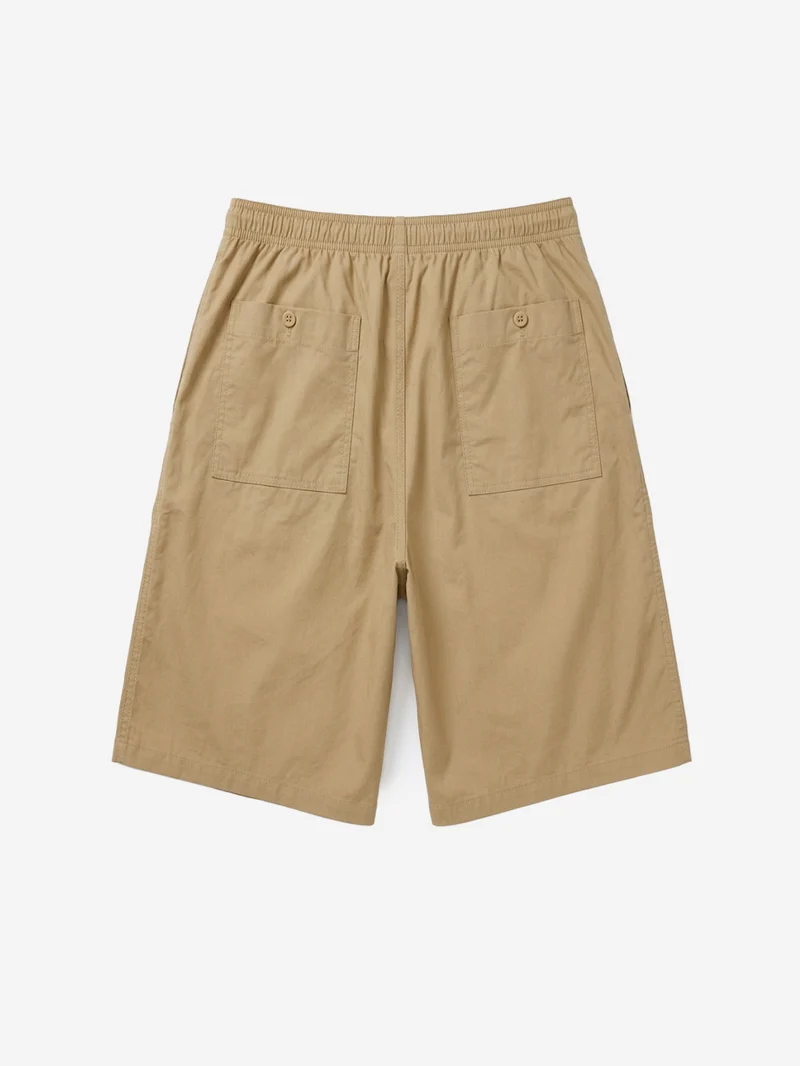 Shorts oversize beige pleated con Swoosh