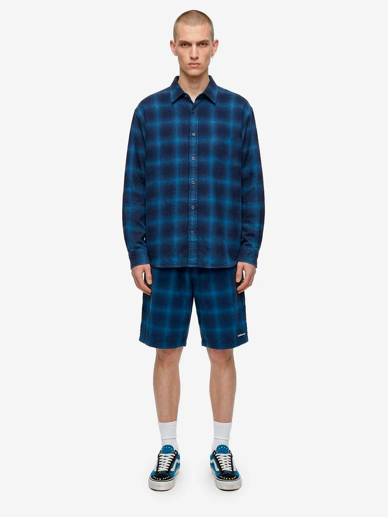 Shorts a quadri indigo