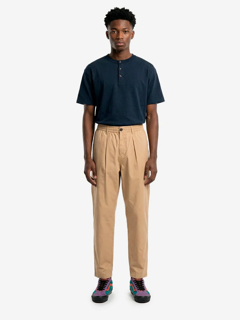Pantaloni beige con piega frontale e coulisse