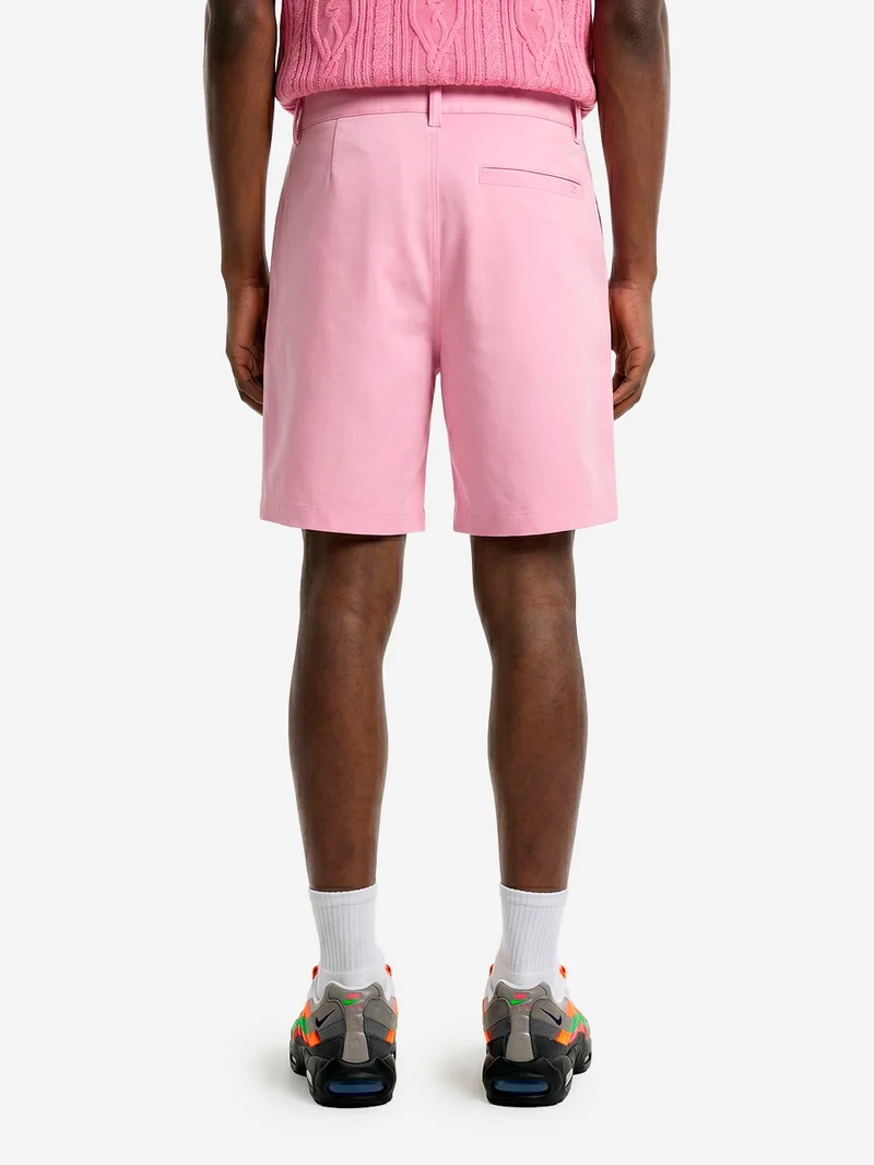 Shorts da golf in tessuto elasticizzato rosa Dri-FIT
