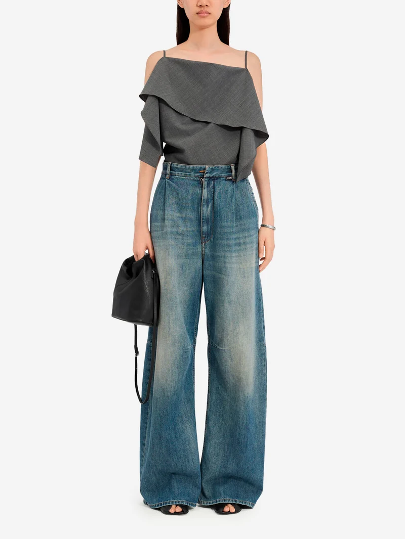 Jeans gamba larga con interruzioni visibili