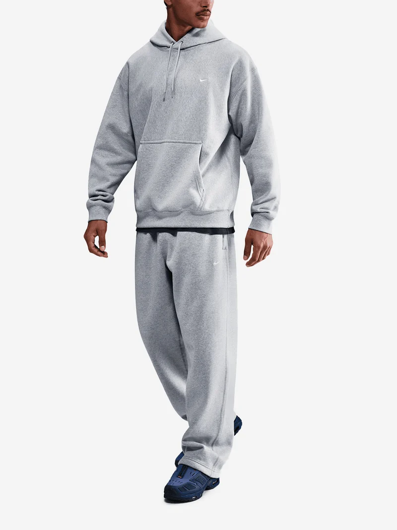 Pantaloni grigi in fleece con orlo aperto