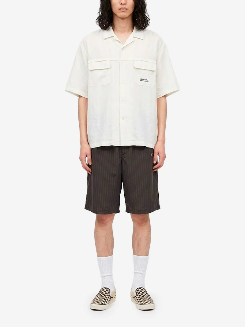 Shorts marroni in cupro con motivo gessato e logo